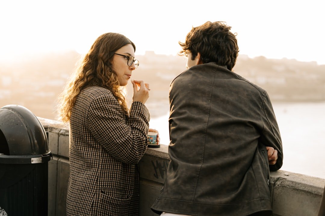 Two partners having a serious repair conversation outdoors
